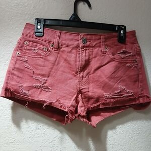 Tomgirl shortie Distressed Denim Shorts size 2 pinkish red American Eagle